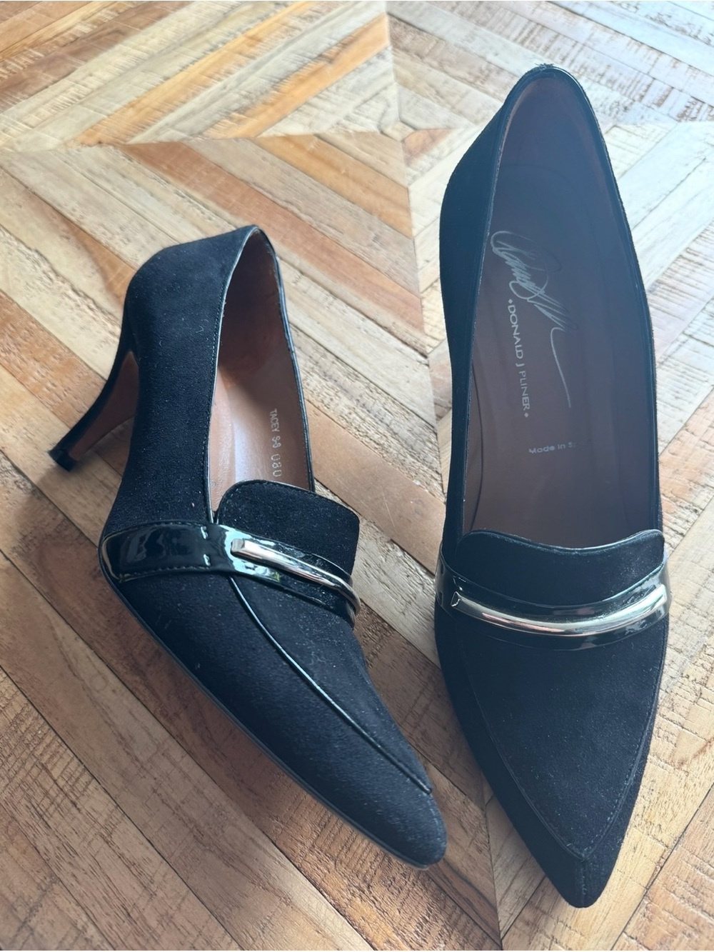 Donald J. Pliner Black Pointed Toe Pumps with Silver Accent